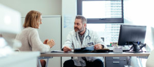 A provider consults with a patient.